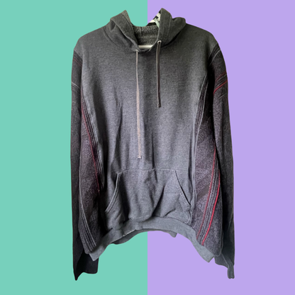 Gray hoodie on a two-tone green and purple background